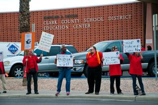Teachers gather in front of the Clark County School District Education Center on East Flamingo Road on Thursday, Jan. 26, 2012, to speak out against the School Board, which was holding a meeting inside.